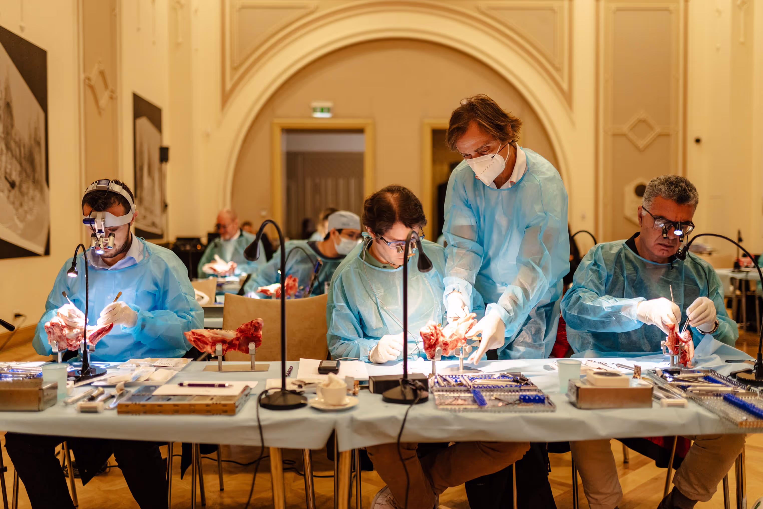 Participants performing hands-on surgical work at the course
