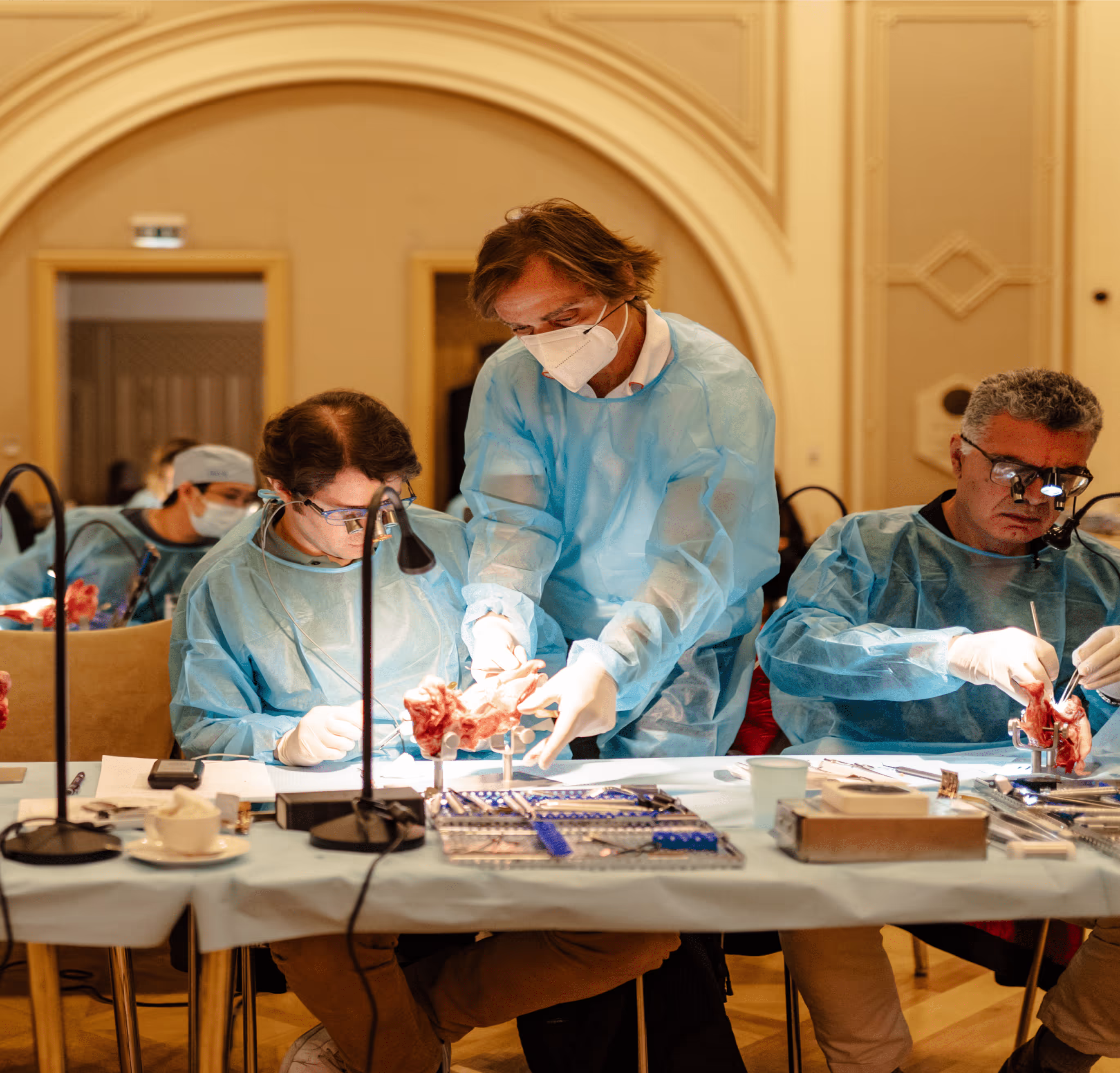 Course participants at a hands-on surgical workstation